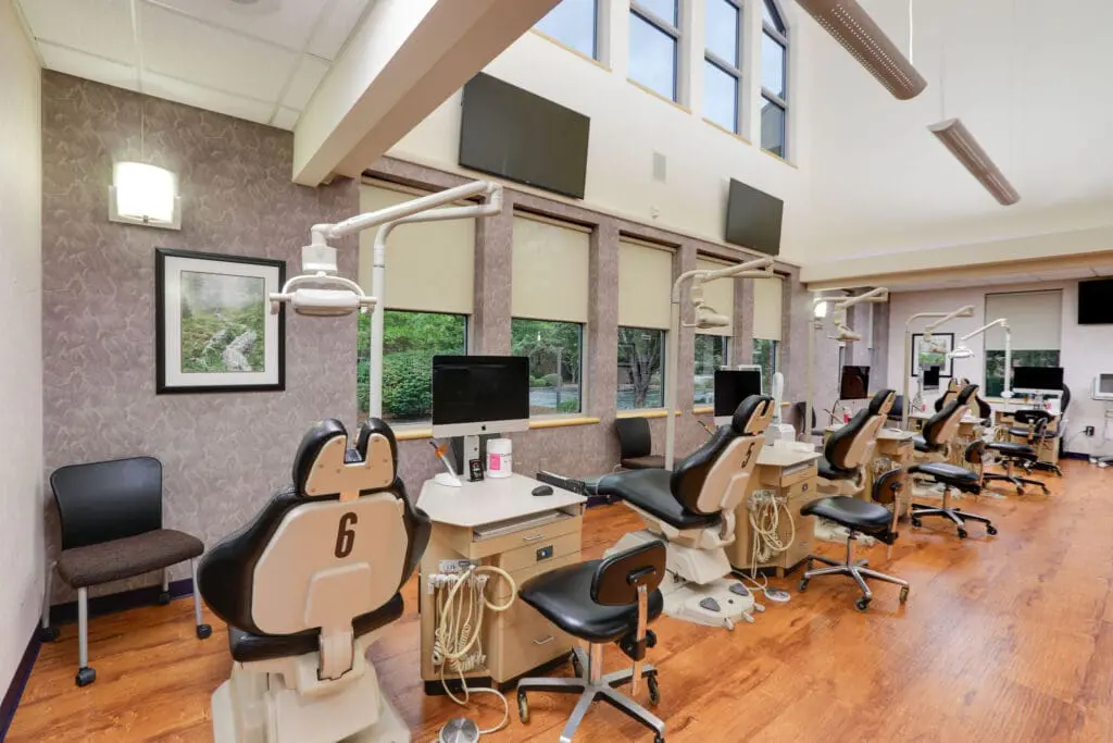 a room with chairs and computers
