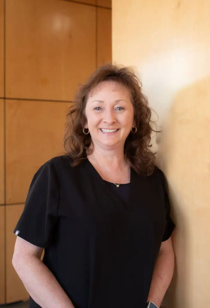 a woman smiling at camera