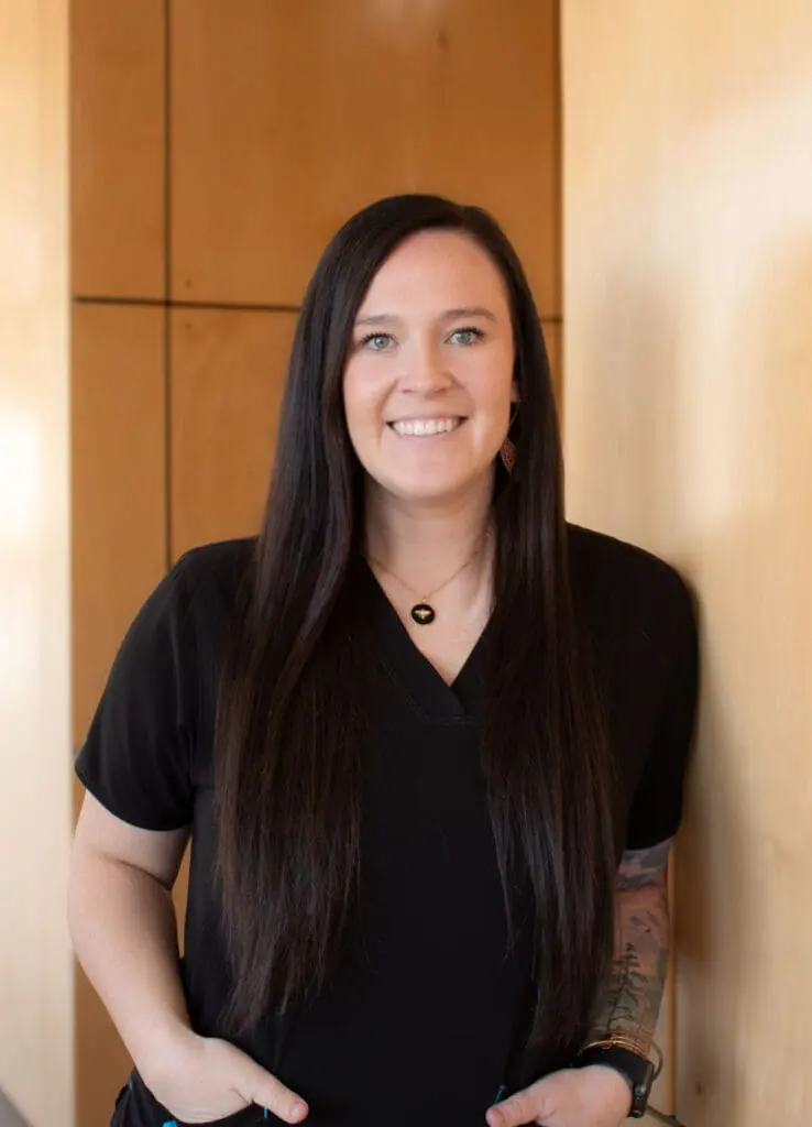 a woman with long hair wearing a black shirt