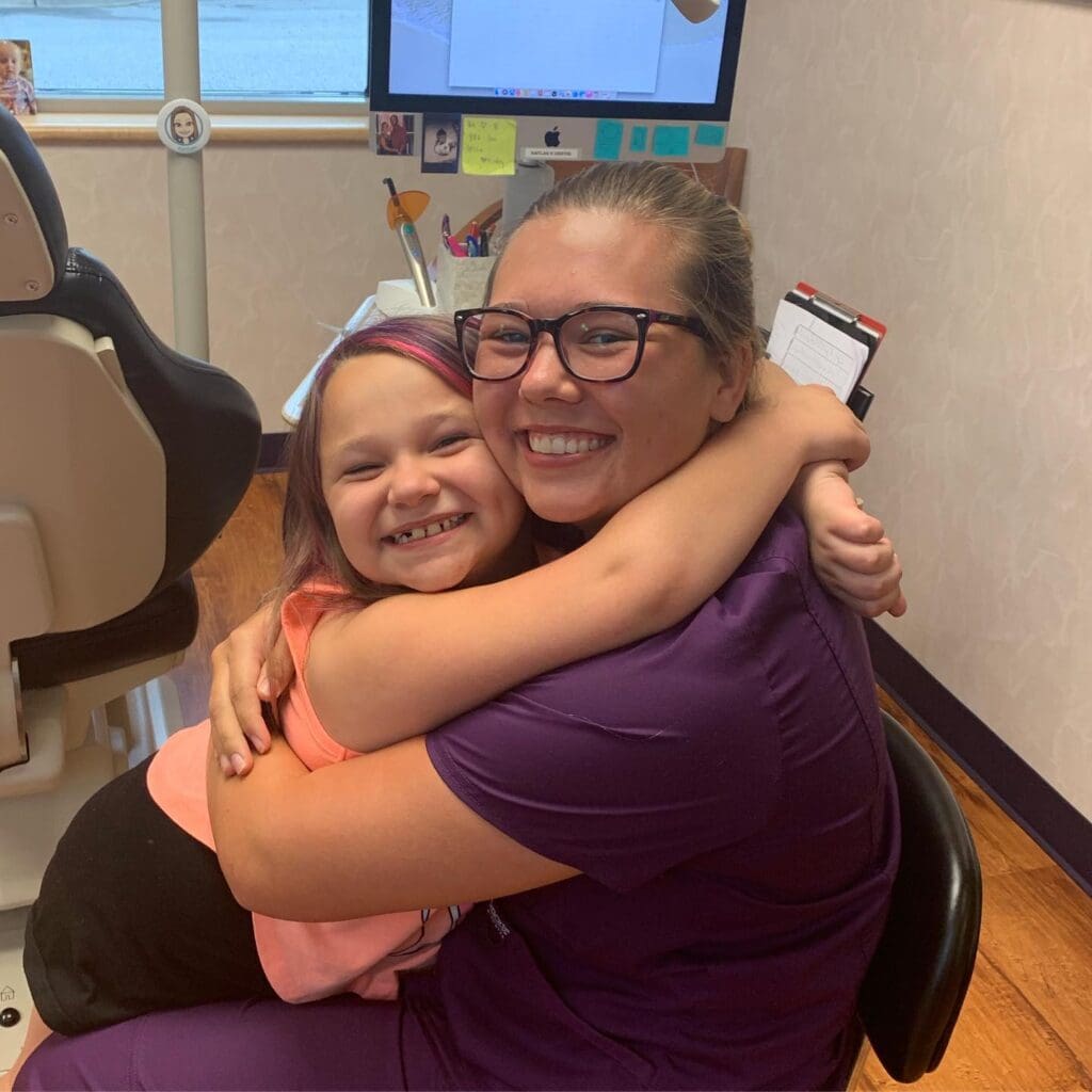 67384912_10156661611383175_8751105808172843008_o Roeder Orthodontics team member hugging a patient