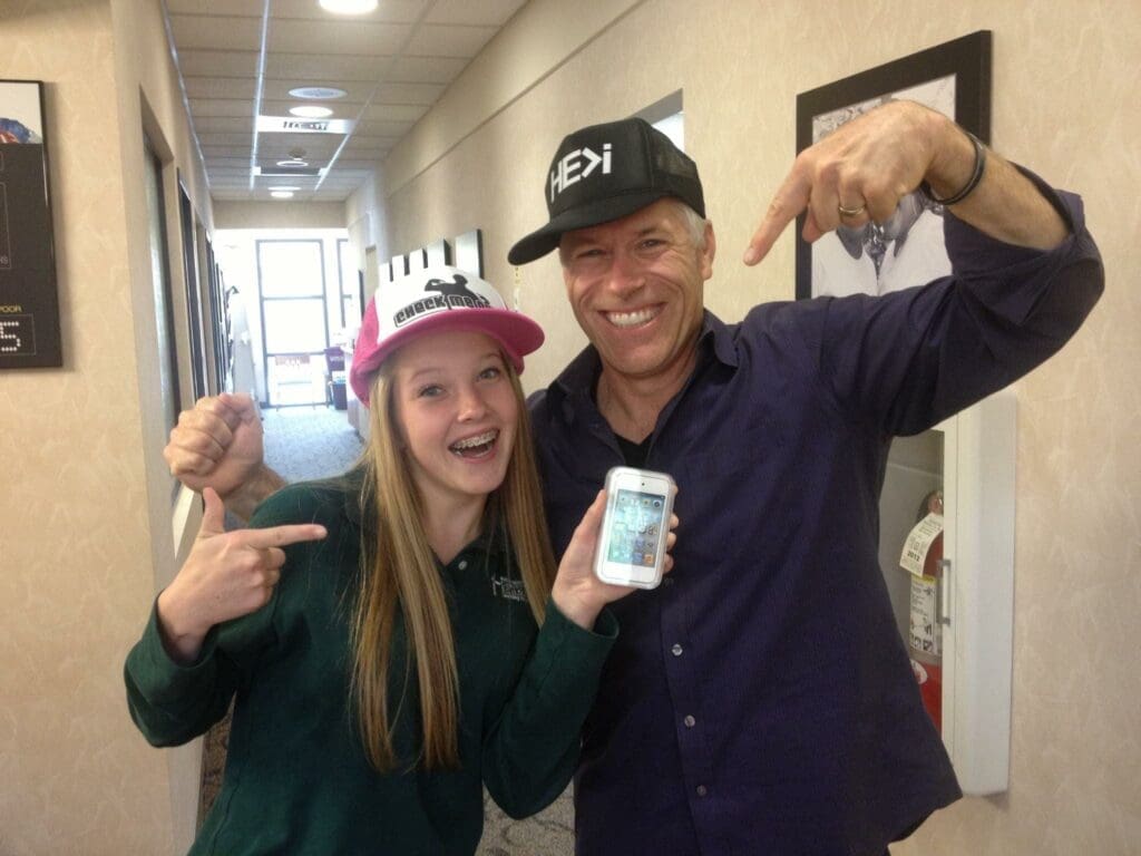 File Nov 21, 2 17 02 AM Dr. Roeder wearing a hat with a patient