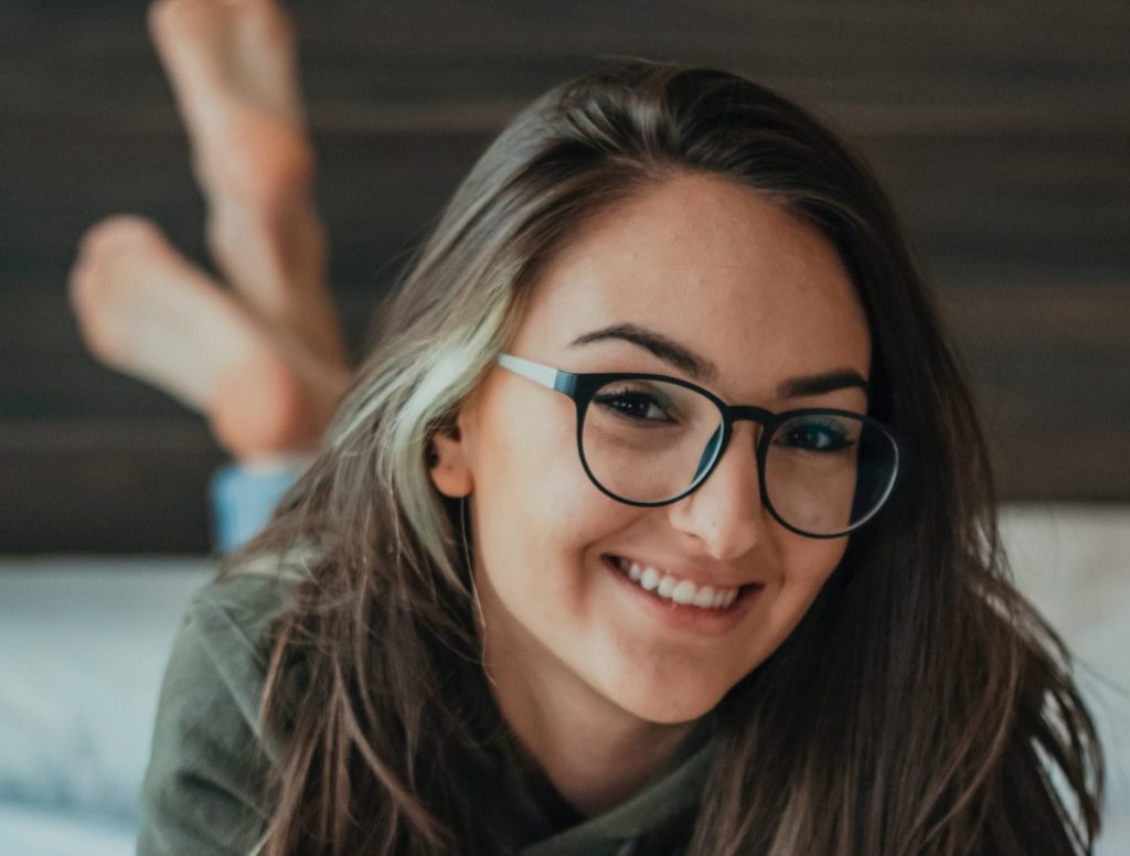 girls smiling with glasses on